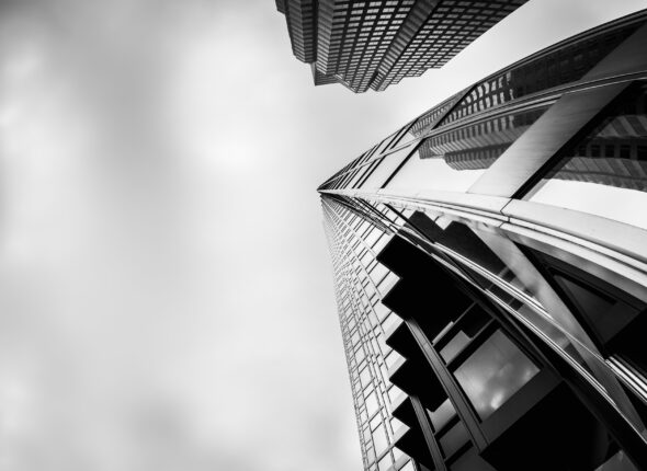 Greyscale low angle shot of high-rise buildings in the financial district of Toronto Canada