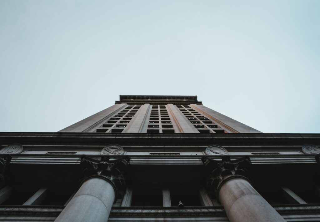 A low angle shot of a tall business building in NYC