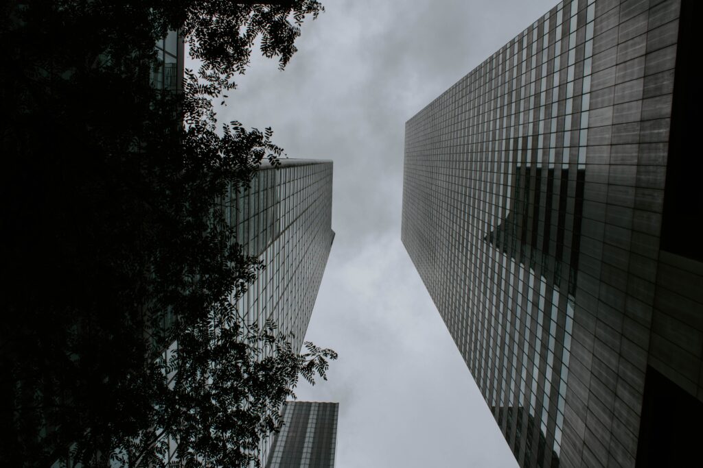 Two tall buildings facing each other shot from a low angle
