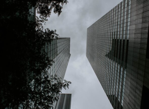 Two tall buildings facing each other shot from a low angle
